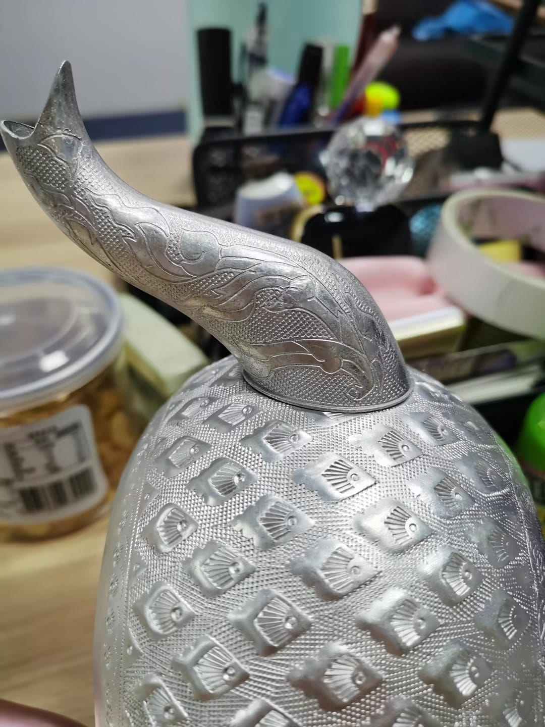 Precision laser welding machine showcasing intricate metal fabrication with detailed engravings