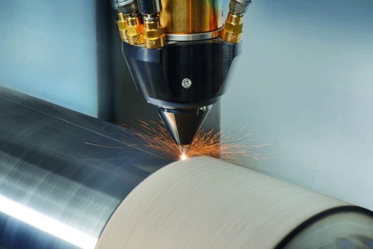 CNC-controlled fiber laser cladding machine performing precision welding on metal surface