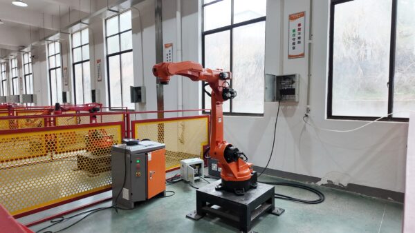 Orange robotic arm in an automated manufacturing setup -3