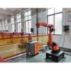 Orange robotic arm in an automated manufacturing setup-4 Orange robotic arm in an automated manufacturing setup-4