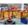 Orange robotic arm performing precision welding in an automated manufacturing setup Orange robotic arm performing precision welding in an automated manufacturing setup